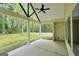 Covered patio offering serene views of the wooded backyard and lush greenery at 241 Ben Horton Dr, Mcdonough, GA 30253