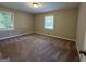 Bedroom showcasing two windows offering plenty of natural light and soft carpet at 3086 Meadow Lark Ln, East Point, GA 30344