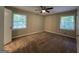 Inviting bedroom with two windows that provide natural light and wall sockets at 3086 Meadow Lark Ln, East Point, GA 30344