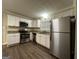 Updated kitchen featuring stainless steel appliances, granite countertops, and white cabinets at 3086 Meadow Lark Ln, East Point, GA 30344