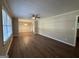 Spacious living room with hardwood floors, neutral walls, ceiling fan, and natural light from window at 3086 Meadow Lark Ln, East Point, GA 30344