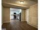 View of a kitchen from the living room that includes granite countertops, stainless steel appliances, and white cabinets at 3086 Meadow Lark Ln, East Point, GA 30344