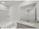 Clean bathroom with a single vanity, granite countertop, and a bathtub at 209 Weldon Rd # 43, Mcdonough, GA 30253