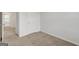 Bright bedroom with neutral walls and carpet, and access to a hallway at 209 Weldon Rd # 43, Mcdonough, GA 30253