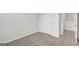 Spacious bedroom with neutral walls, carpet, and a door at 209 Weldon Rd # 43, Mcdonough, GA 30253