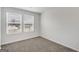 Bright bedroom with neutral walls and carpet, featuring two large windows at 209 Weldon Rd # 43, Mcdonough, GA 30253