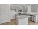 Modern kitchen with gray cabinets, granite countertops, and an island at 209 Weldon Rd # 43, Mcdonough, GA 30253