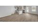 Modern kitchen featuring gray cabinets, granite countertops, and an island at 209 Weldon Rd # 43, Mcdonough, GA 30253