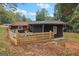 Fenced yard with exterior home structure, offering room to enjoy the outdoors at 1973 Glendale Dr, Decatur, GA 30032
