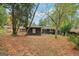 Wooded backyard with home exterior, blending nature with modern living at 1973 Glendale Dr, Decatur, GA 30032