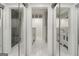 This renovated bathroom features multiple glass enclosed showers and a double vanity at 1973 Glendale Dr, Decatur, GA 30032