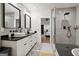 Bathroom features double sink vanity, walk-in shower, and modern lighting fixtures at 1973 Glendale Dr, Decatur, GA 30032