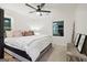 This primary bedroom features a ceiling fan, a patterned rug and black door trim at 1973 Glendale Dr, Decatur, GA 30032