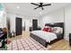 Well-lit bedroom with ceiling fan, wood floors, and spacious layout at 1973 Glendale Dr, Decatur, GA 30032