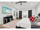 Bright bedroom with stylish decor, wood floors, and ensuite bathroom access at 1973 Glendale Dr, Decatur, GA 30032