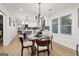 The dining room features a glass table set with modern chairs, complemented by contemporary lighting at 1973 Glendale Dr, Decatur, GA 30032