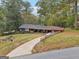 Charming home with a long driveway and well-maintained front yard at 1973 Glendale Dr, Decatur, GA 30032
