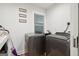 Bright laundry room with modern washer and dryer, and built-in sink at 1973 Glendale Dr, Decatur, GA 30032