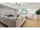 Bright living room with a modern fireplace, TV and gray sofa on a hardwood floor at 1973 Glendale Dr, Decatur, GA 30032