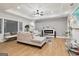 Stylish living room featuring a modern fireplace, sleek gray accent wall and hardwood floors at 1973 Glendale Dr, Decatur, GA 30032