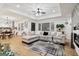 Open living room showcases stylish sectional sofa, decor, and natural light from large windows at 1973 Glendale Dr, Decatur, GA 30032