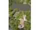 Beautiful aerial view of a home near a lake surrounded by lush greenery and neighboring houses at 22 Agean Way, Whitesburg, GA 30185