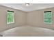Bedroom featuring neutral walls, plush carpet and large windows that provide plenty of light at 22 Agean Way, Whitesburg, GA 30185