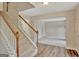 Welcoming entryway with a staircase and hardwood floors at 22 Agean Way, Whitesburg, GA 30185