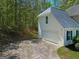 Spacious two-car garage featuring a clean driveway and a well-maintained exterior with yard at 22 Agean Way, Whitesburg, GA 30185