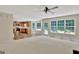 Bright, open living room with a view of the kitchen and lots of natural light at 22 Agean Way, Whitesburg, GA 30185