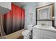 Clean bathroom with a tub shower, vanity, and shelves at 785 Seabolt Rd, Locust Grove, GA 30248