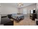 Bright bedroom with carpeted floors and ceiling fan at 785 Seabolt Rd, Locust Grove, GA 30248