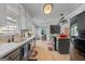 Modern kitchen with gray cabinets and hardwood floors at 785 Seabolt Rd, Locust Grove, GA 30248