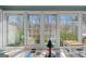 Sunroom with multiple windows and wooded views at 785 Seabolt Rd, Locust Grove, GA 30248