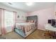 Bright bedroom with a plush bed, window seating, and a workspace at 5602 Waverly Park, Atlanta, GA 30349