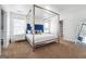 Elegant bedroom featuring a canopy bed and ensuite bathroom at 5602 Waverly Park, Atlanta, GA 30349