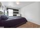 Bedroom with dark-colored bedding and large window at 5602 Waverly Park, Atlanta, GA 30349