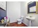 Elegant powder room with pedestal sink and gold accents at 5602 Waverly Park, Atlanta, GA 30349