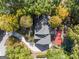 Aerial view of the house, showcasing the architectural roofline and lush surroundings at 7300 Chattahoochee Bluff Dr, Sandy Springs, GA 30350