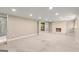Large carpeted basement area with a fireplace, recessed lighting, and an attached bathroom at 7300 Chattahoochee Bluff Dr, Sandy Springs, GA 30350