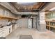 Unfinished basement showcasing utilities and work area with a workbench at 7300 Chattahoochee Bluff Dr, Sandy Springs, GA 30350