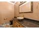Stylish powder room featuring a vessel sink, granite countertop, and marble flooring at 7300 Chattahoochee Bluff Dr, Sandy Springs, GA 30350