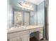 Bright bathroom featuring a white sink vanity with a large mirror and drawers at 7300 Chattahoochee Bluff Dr, Sandy Springs, GA 30350