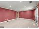 Neutral carpeted bedroom with an exterior door and lots of natural light at 7300 Chattahoochee Bluff Dr, Sandy Springs, GA 30350
