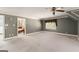 Expansive gray bedroom with a ceiling fan, windows, and access to an ensuite bathroom at 7300 Chattahoochee Bluff Dr, Sandy Springs, GA 30350