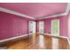Light-filled bedroom boasting hardwood floors, crown molding, and large windows at 7300 Chattahoochee Bluff Dr, Sandy Springs, GA 30350