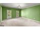Bright, empty bedroom featuring neutral carpet and natural light from the windows at 7300 Chattahoochee Bluff Dr, Sandy Springs, GA 30350