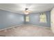 Spacious bedroom featuring carpet, and natural light from the windows at 7300 Chattahoochee Bluff Dr, Sandy Springs, GA 30350
