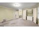 Spacious bedroom with carpet, closet, and access to a bathroom with a double sink vanity at 7300 Chattahoochee Bluff Dr, Sandy Springs, GA 30350