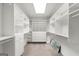 Bright walk-in closet with an abundance of shelving, drawers, and storage space at 7300 Chattahoochee Bluff Dr, Sandy Springs, GA 30350